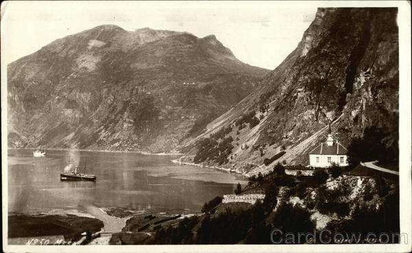Boat in the Water surrounded by Mountains Steamers