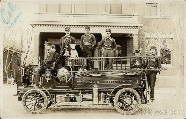 Firemen in Uniform on Firetruck with Dog Lamar Colorado