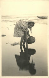 Woman Working on the Beach with a Basket Postcard
