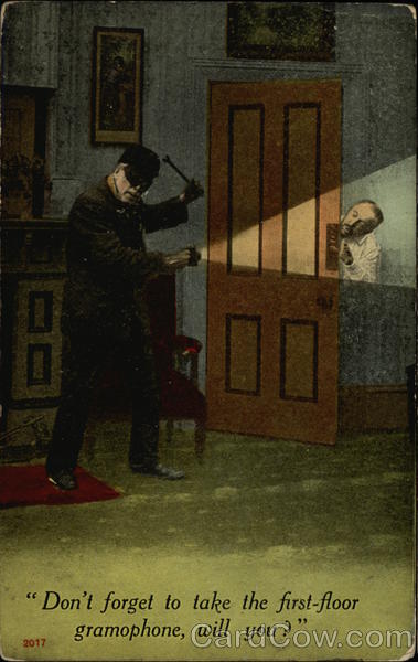 A masked burglar and a man peeking out from behind a door