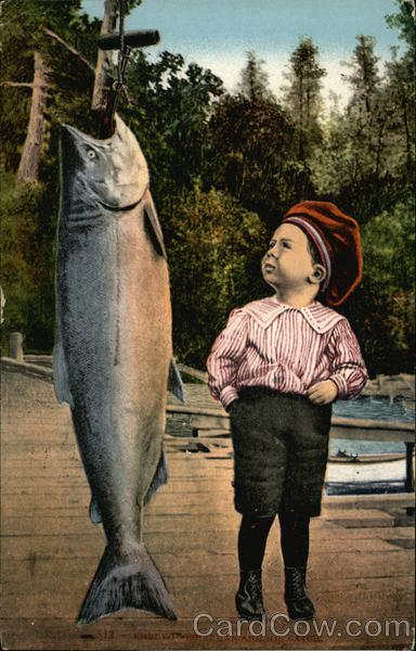 Small boy looking at a very large fish Fishing