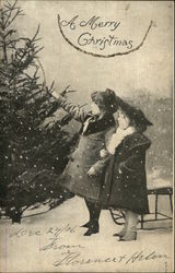 Two Children in Snowfall Picking out Tree Postcard