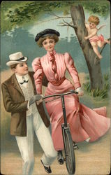 Couple on Bicycle, Cupid in Tree Postcard