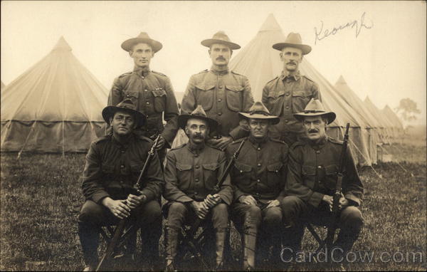 Group of Men in Military at a Camp