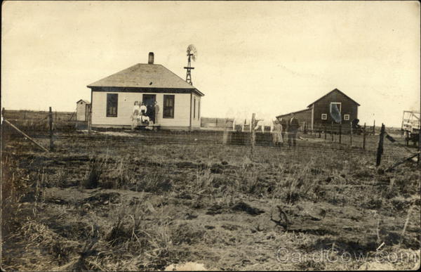 Family Sitting on Farmhouse Porch Farming