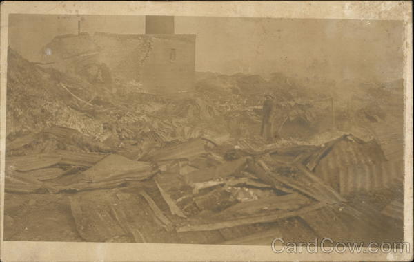 Man Standing in Rubble from a Building Disasters