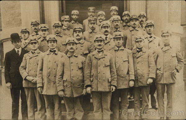 Group of Officers in Uniform with One Man in a Suit