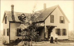 Woman, Girl, and Baby in Front of House with Baby Carriage in 1918 Woman, Girl, and Baby in Front of House with Baby Carriage in 1918