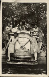 Six Young Women Posing by a Faucet Postcard