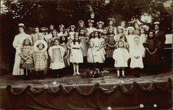 Group of Children on Stage with their Teachers Group of Children on Stage with their Teachers