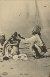 Ear Picker at work on a Man in India Postcard