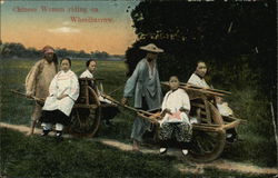 Chinese Women Riding on Wheelbarrow Chinese Women Riding on Wheelbarrow