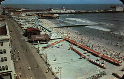 Panoramic View of Boardwalk and Beach Looking Towards Steel Pier Postcard