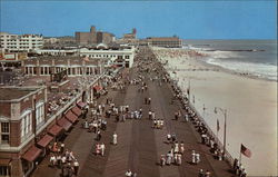 Looking down the Boardwalk and Beach toward the Convention Hall Asbury Park, NJ Postcard Postcard Postcard