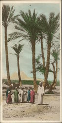 Man and Children Standing in Front of the Pyramids Postcard