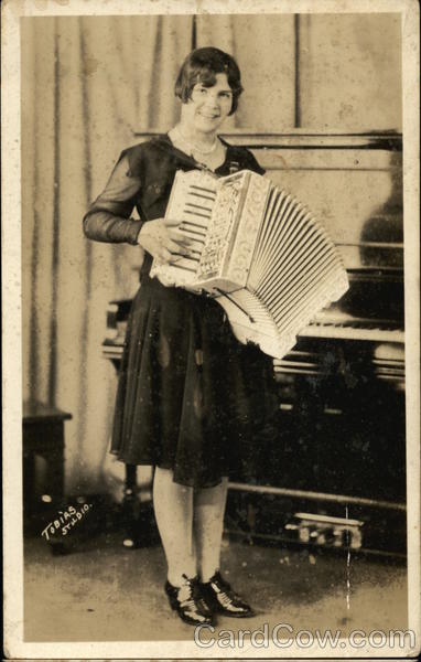 Woman In Dark Dress Plays The Accordion Women