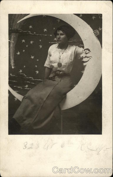 Woman Sitting on a Paper Moon Moons