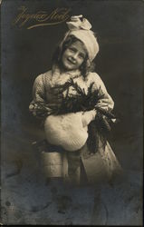 Child with Winter Clothes and Pine Wreath Postcard