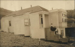 Family Posing on Porch of Home Postcard