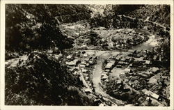 View of Town on Bend in River - Idaho? Postcard