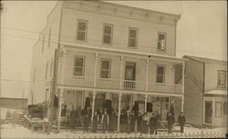 People Gathered in Front of Three-Story Building Postcard