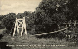 Swinging Bridge from Gateway Inn to Lake Wononscopomuc Postcard