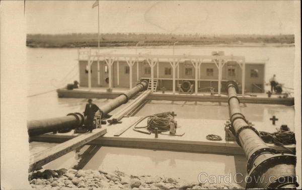 River Barge Connected to Pipes Boats, Ships