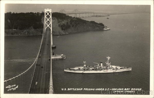 U.S. Battleship Passing Under San Francisco and Oakland Bay Bridge California