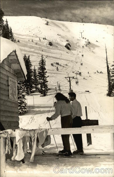 Two People on Skis near Ski Slope Skiing