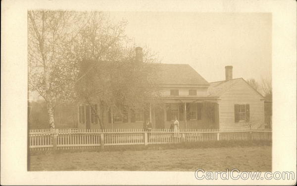 Couple Posing in Front Two-Story House Glastonbury Connecticut