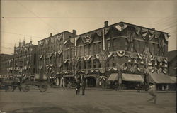 Street Junction with Building Covered in Flag Banners Postcard