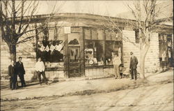 Men Posing in front of a Storefront Postcard