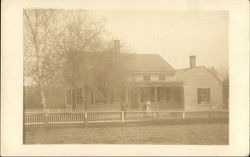 Couple Posing in Front Two-Story House Postcard