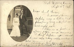 Photo of Couple in front of House Postcard