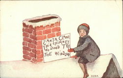 Boy Holding Sign for Santa on Roof Postcard