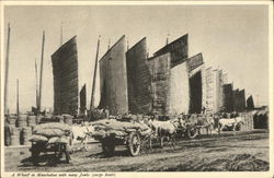 A Wharf in Manchukuo with Many Junks (Cargo Boats) Postcard