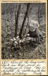 Boy Looking at Flower in Park Postcard