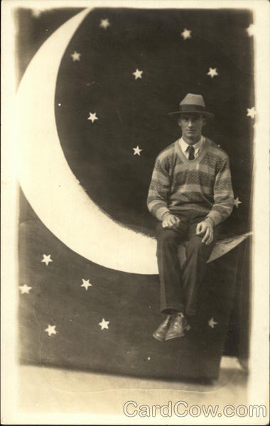 Portrait of Man Sitting on Paper Moon Moons
