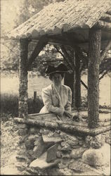 Woman at Rustic Wishing Well Postcard