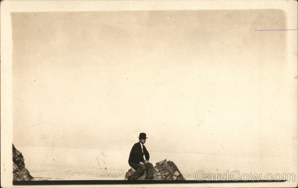 Man Sitting On Rock By Shore Santa Catalina Island California