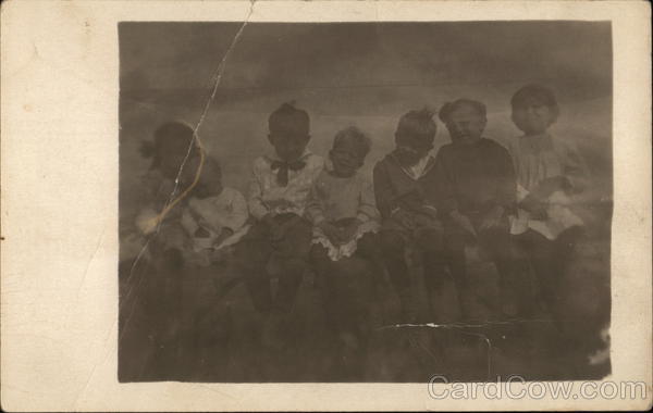Snapshot of Children on Fence