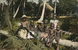 Children Sitting on Fallen Palm Tree Children Sitting on Fallen Palm Tree