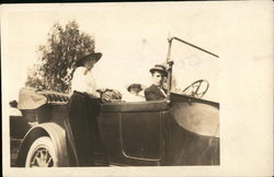 Posing on a Car Postcard