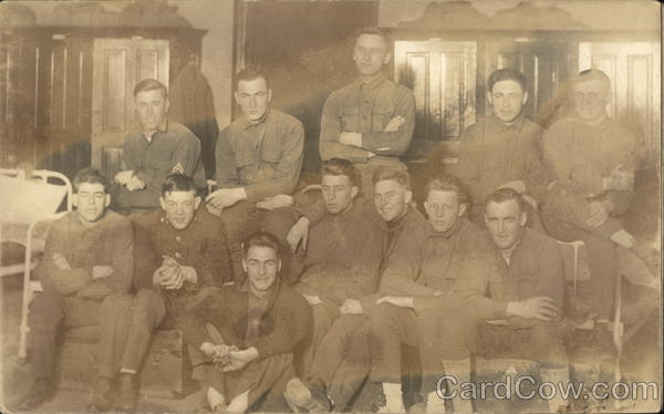 Snapshot of Men Sitting on Bunk Military