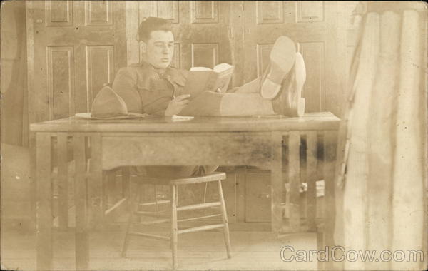 Soldier Reading at Table Military