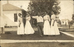 Snapshot of Man and 3 Women Postcard
