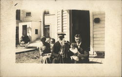 Snapshot of Family on Porch Postcard