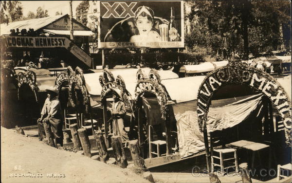 Men on Boats Xochimilco Mexico