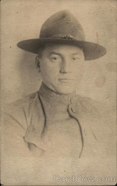 A man wearing a hat, possibly a soldier Army