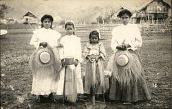 Latin American Women holding straw hats Latin American Women holding straw hats